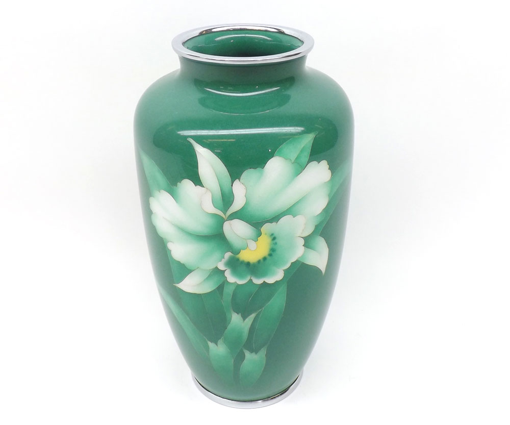 An enamelled baluster Vase decorated in colours with flowering foliage, predominately in famille