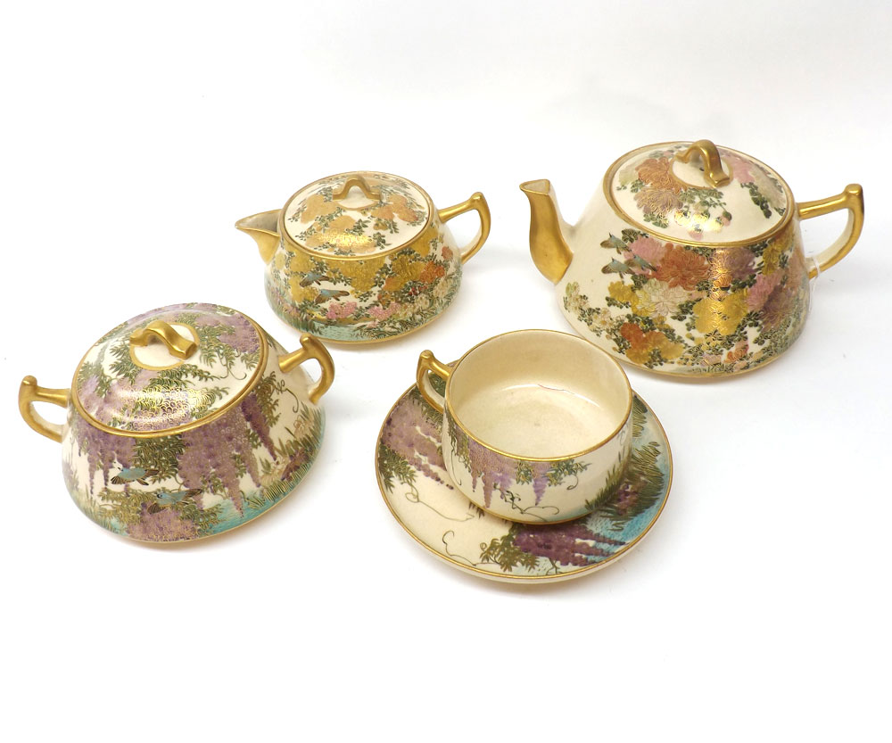A Satsuma Tea Service, typically decorated in traditional colours with birds and flowering foliage