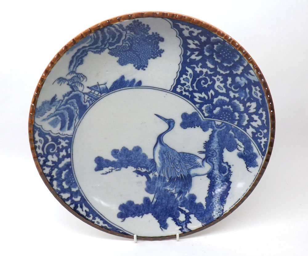 A Chinese circular Plate decorated in under glazed blue with panels of cranes and foliate, 12?