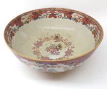 A Chinese Export circular Bowl, painted in colours with urns and flowering foliage, etc, (rim chip
