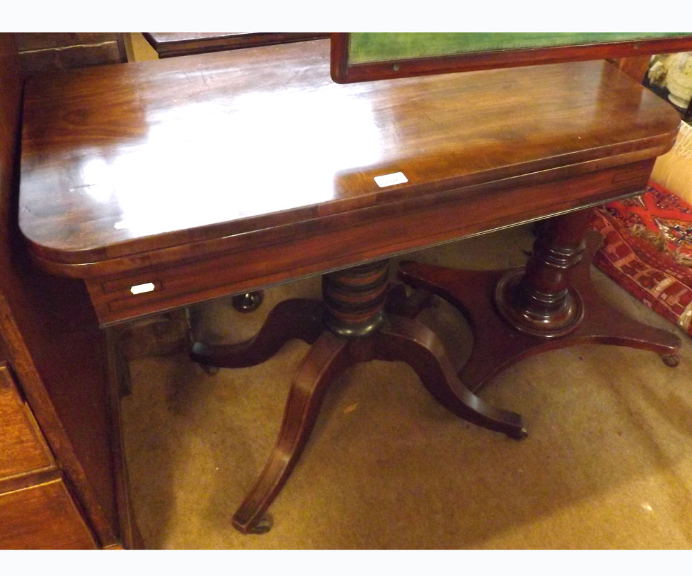 An early 19th Century Mahogany fold top Card Table of rectangular form with rounded corners, the