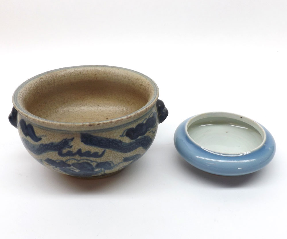 A small Chinese circular compressed Pot of baluster form, decorated in plain under glazed blue, the