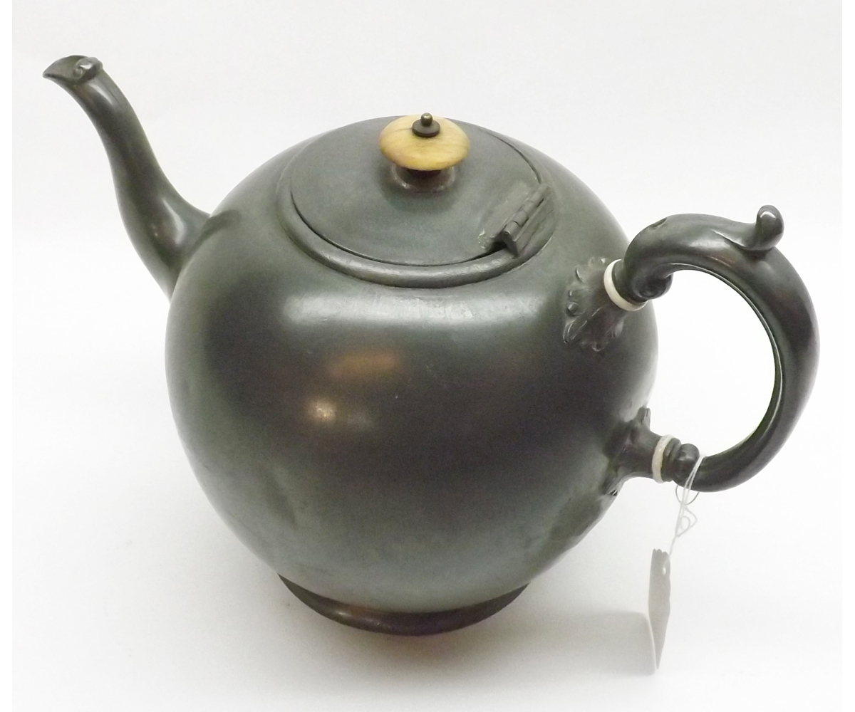 A James Allen Sheffield Pewter Teapot of round form with hinged lid and swept handle, 8? high