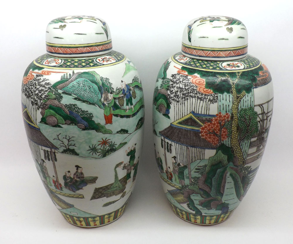 A pair of large Chinese covered Vases of tapering circular form, each with domed covers and the