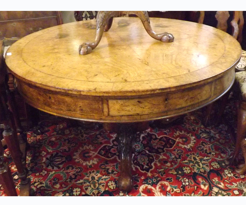 A 19th Century Pollard Oak drum Table, cross banded top and frieze fitted all round with alternate