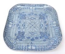 An Oriental square Dish with curved corners, decorated in under glazed blue with geometric floral