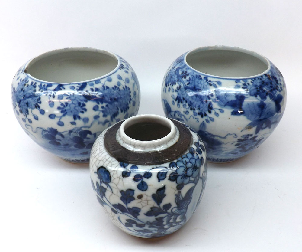 A near pair of Chinese Jardinières each decorated in under glazed blue with scenes and foliage and