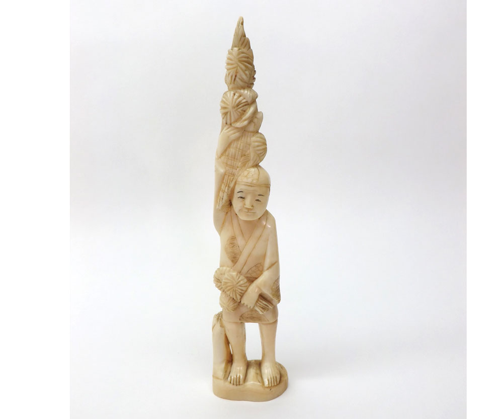 An Oriental carved Ivory Okimono modelled as a Sponge Seller, 6 ¼" high Condition:Appears a little