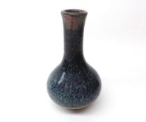 A Chinese Pottery Spill Vase of baluster form, decorated in multi-coloured wash design in the drip-