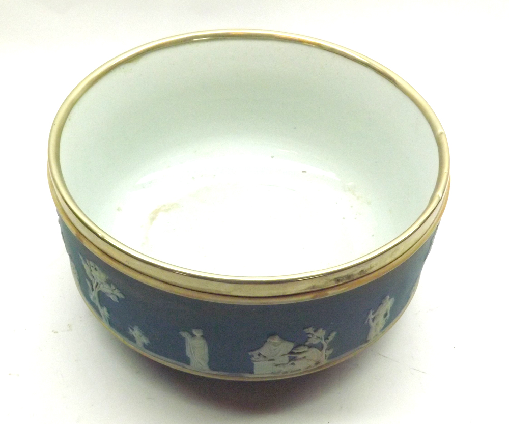 A Wedgwood blue Jasper Ware round Salad Bowl, fitted with Silver-plated rim, typically decorated