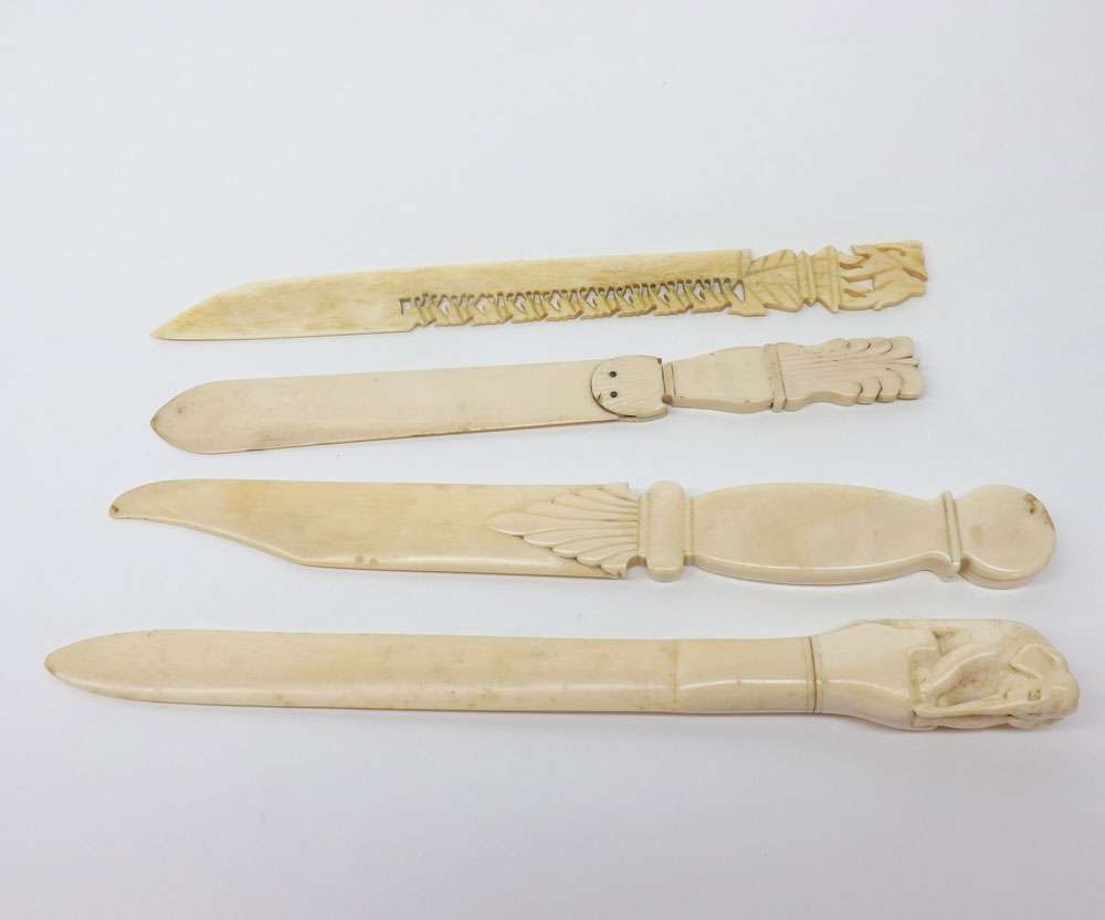 A collection of four various carved Ivory Paper Knives, all approximately 10? long