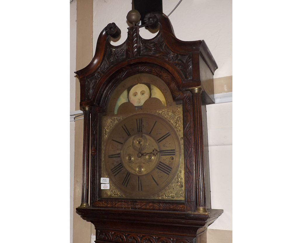 A 19th Century Oak Long Case Clock, Johnson of Gallway, the arched Brass face with lunar dial,