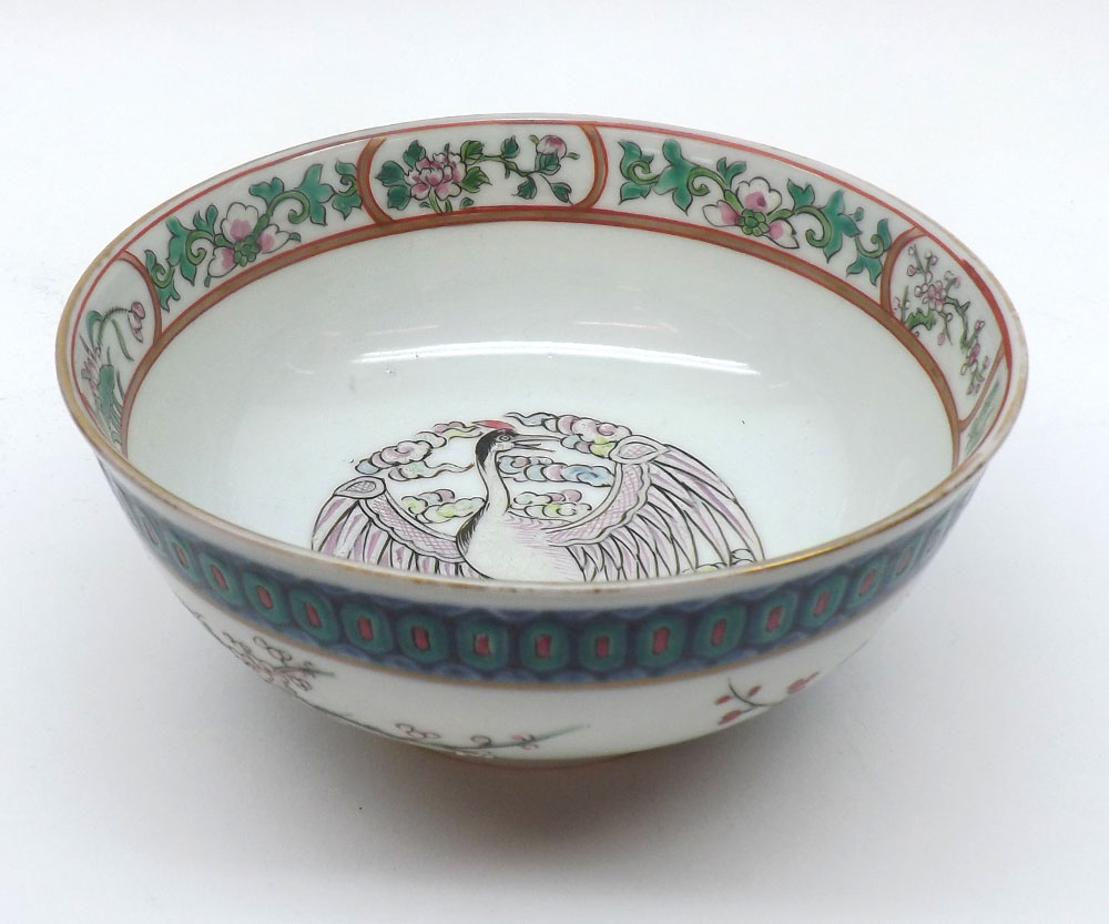 A Chinese circular Bowl of tapering form, the central panel painted in famille verte with famille