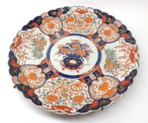 A Japanese Imari Charger of circular form with hipped rim, decorated with a typical