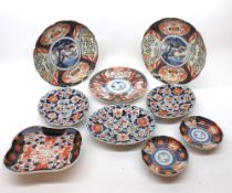 A collection of 19th Century and later Imari wares comprising two circular Dishes, circular Plate,