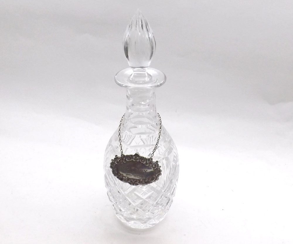 A 20th Century Clear Cut Glass Decanter with pointed stopper, together with a contemporary