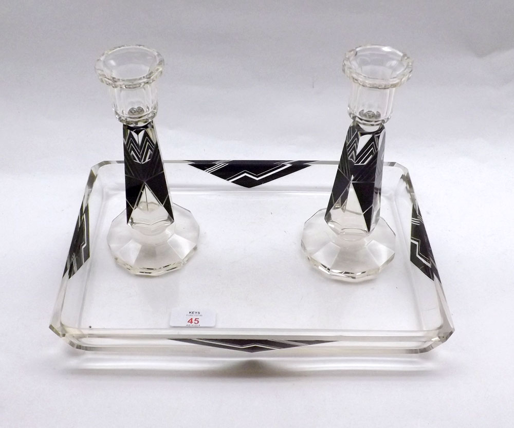 An Art Deco Clear and Black Glass Dressing Table Tray and accompanying pair of Candlesticks,