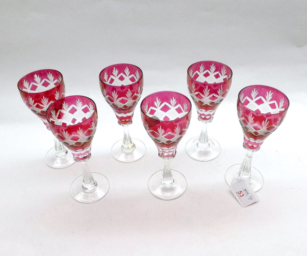 A set of six Cranberry and Clear Cut Glass Small Wines, decorated with geometric detail, 6? high