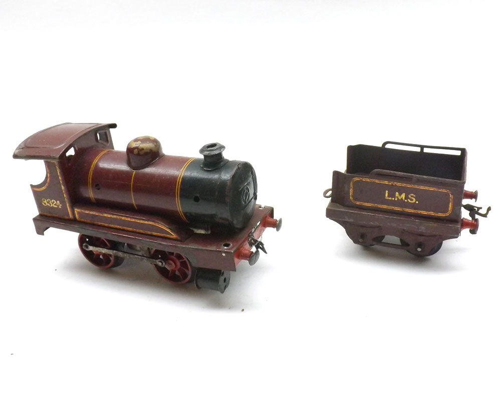 Hornby O Gauge Tin Plate Clockwork L.M.S. Locomotive and Tender in maroon livery (play worn