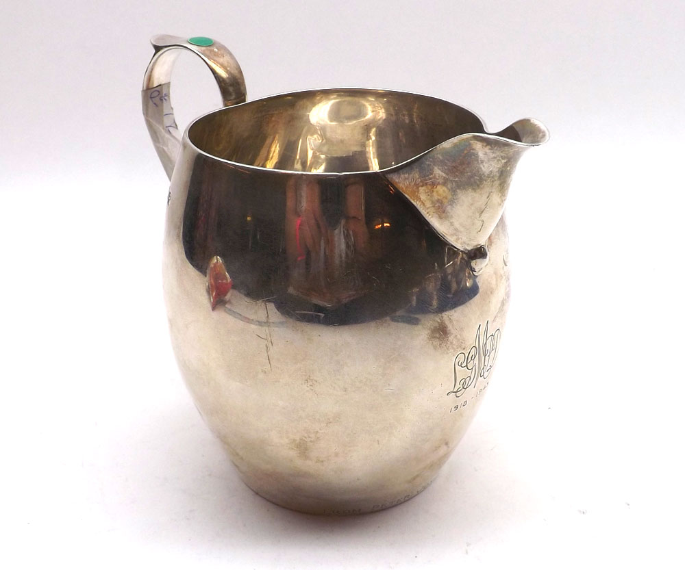 A George VI Squat Silver Jug, with swept handle, presentation inscription to front, London 1941,