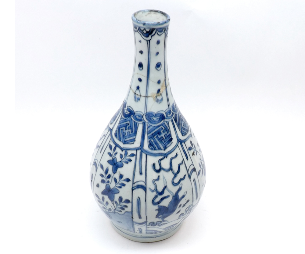 A Chinese baluster Vase of spreading circular form painted in under glazed blue with panels of