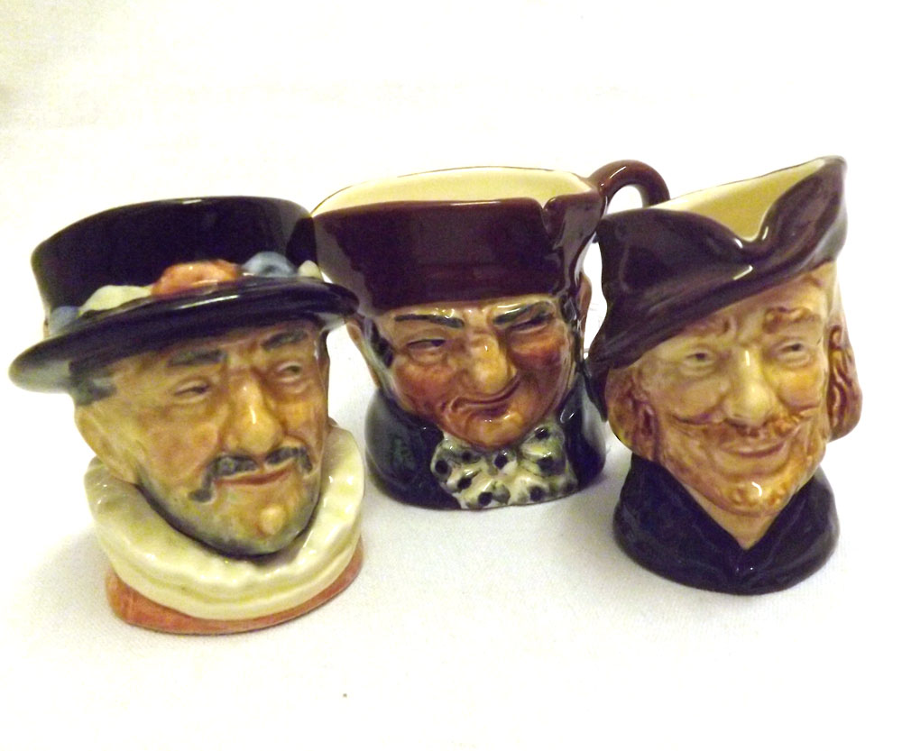 A collection of three Royal Doulton Small Character Jugs: Robin Hood, Beefeater, Old Charley, all