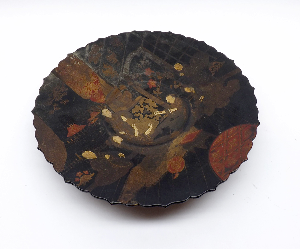 A Papier-mâché Dish of circular form with a slightly spreading foot, decorated with figures and