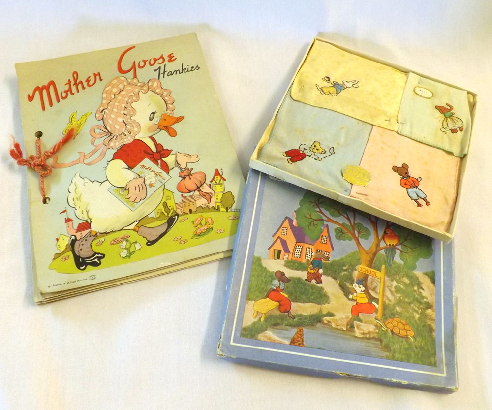 A 1950s box of Children?s Hankies, embroidered with animal characters; together with a Mother Goose