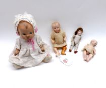 Four early 20th Century Doll House Type Dolls to include: two Nippon Bisque Head Dolls, an unmarked