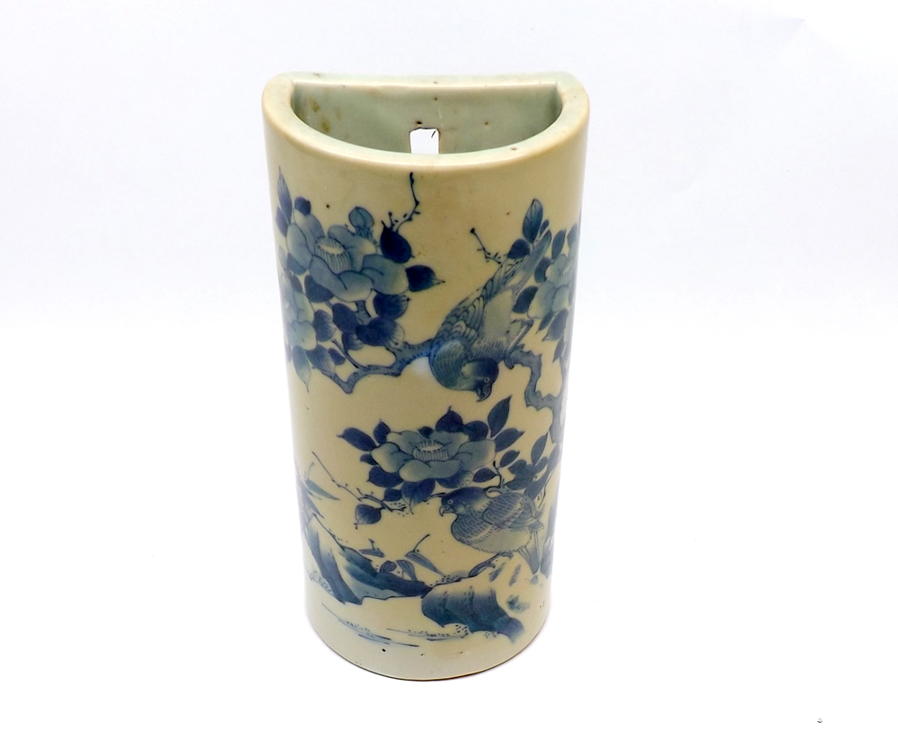 A 20th Century Oriental Cistern Vase of demi-lune form, the body painted in underglaze blue with