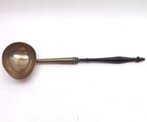 A mid-18th Century Silver Punch Ladle with ebonised handle (loose) to an egg-shaped bowl, probably