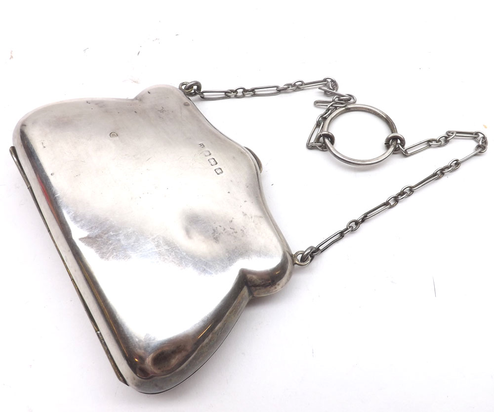 An early 20th Century Silver Purse, of hinged form with material lined interior, and fitted with