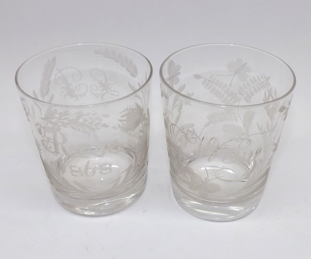 Two heavy Glass Whisky Tumblers, one etched with thistles and foliage and inscribed ?Rose 1868?,