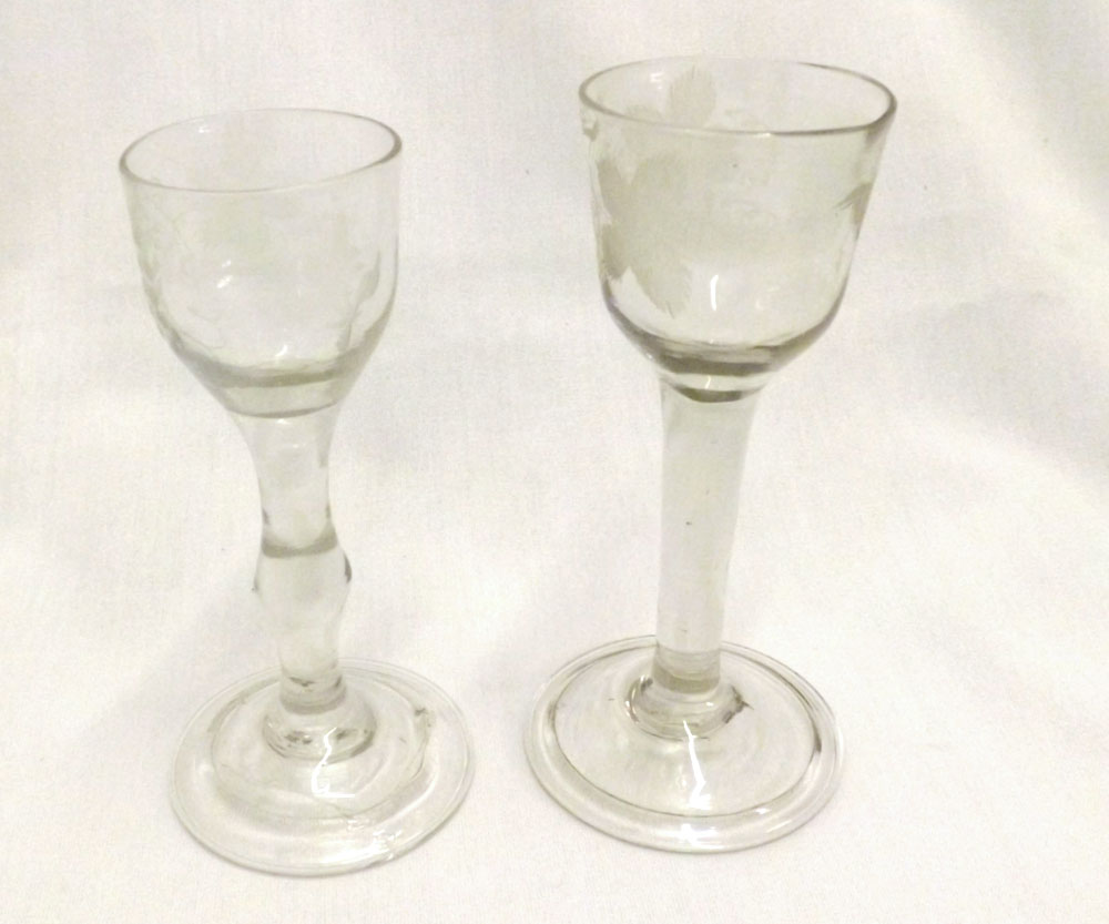 Two 18th Century dwarf Ale Glasses, the bowls etched with berries and foliage, (one with extensive