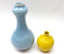An Oriental Blue Glazed Baluster Vase of double-gourd form, the body impressed with circular