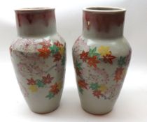 A pair of large Crackle Glaze Baluster Vases, painted in iron red, green and yellow with a flowering