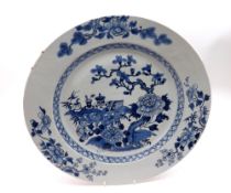 An Chinese Circular Charger, painted in underglaze blue with central panel of flowering tree and