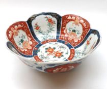 A Japanese Imari Circular Bowl of tapering form with hipped rim, typically decorated in