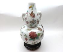 A late 20th Century Chinese two handled baluster Vase of double gourd form, well painted in