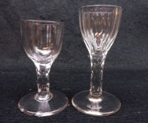 A late 18th Century small Wine Glass with bucket bowl and facet cut stem on a spreading circular