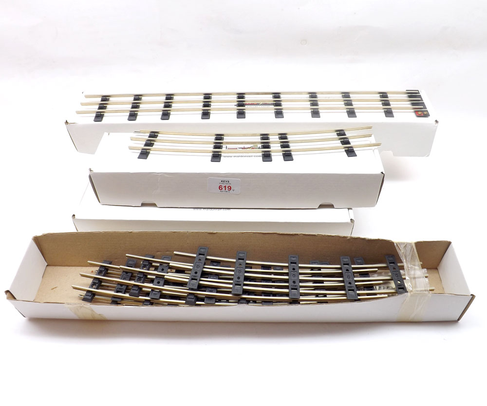 Four Boxes of O Gauge New Model Railway Track comprising of straight and curved rails