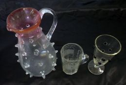 A Mixed Lot comprising: an early 20th Century Art Glass Jug with cranberry top and clear glass