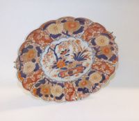 A Japanese Imari Dish of circular scalloped form, typically decorated in traditional colours with a
