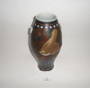 An Oriental Baluster Vase, overlaid with a gilded bird motif on a dark brown ground with various