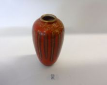 An Oriental Baluster Vase, gilded with geometric foliage on an iron red ground, iron red 6