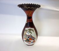 An Oriental Baluster Vase with flared crimped rim, the body painted in iron red, famille noir and