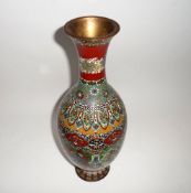 An Oriental Cloisonné Baluster Vase, brightly decorated in iron red, black, pale blue, pale green