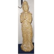 A 20th Century Statuette of an Oriental Figure in a devout pose wearing ceremonial robes, decorated