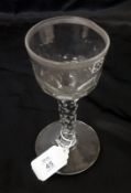 A late 18th early 19th Century Clear Glass Wine, with cut facetted stem, raised on a spreading