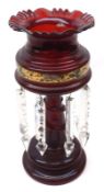 A Victorian Ruby Glass Lustre Vase with frilled rim, tapering stem with serpent detail, raised on a